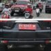 Mobil Plat Merah BH 1247 W Parkir di Lampu Merah Simpang TUGU